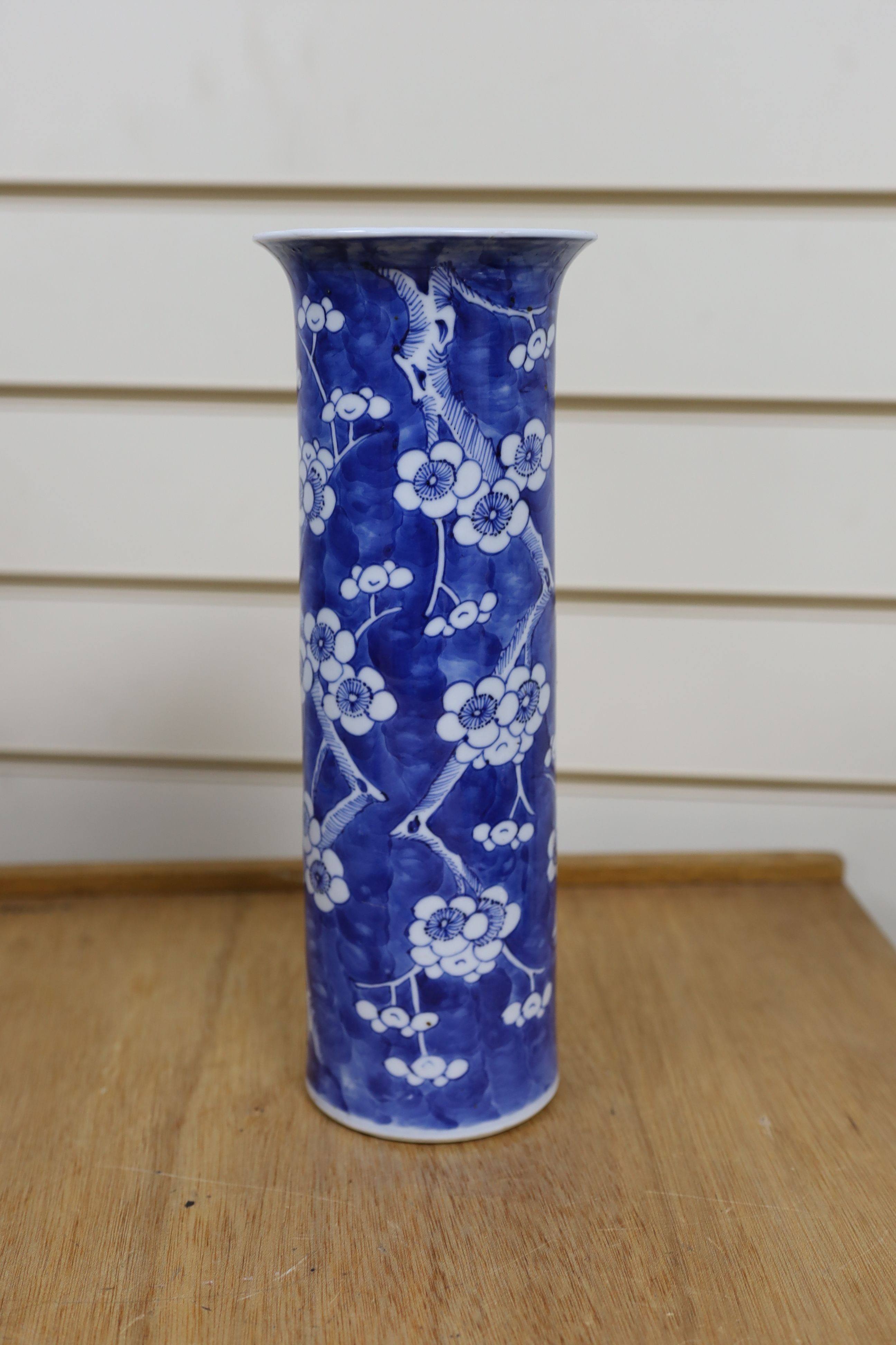 A Chinese blue and white gourd vase with landscape decoration, a similar blue and white sleeve vase and a Japanese Kutani vase